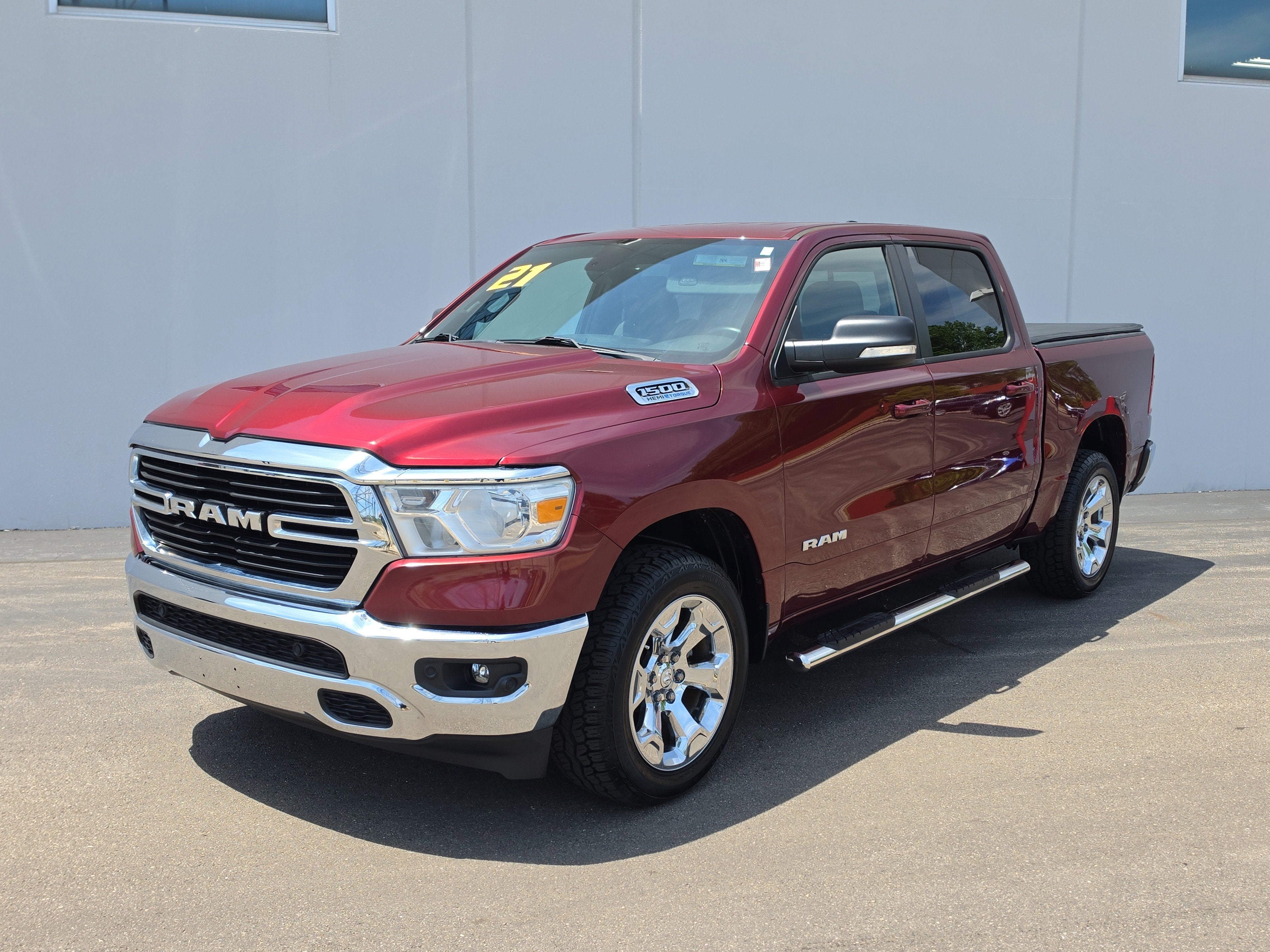 2021 RAM 1500 Big Horn in Delmonico Red Pearlcoat — front three-quarter view