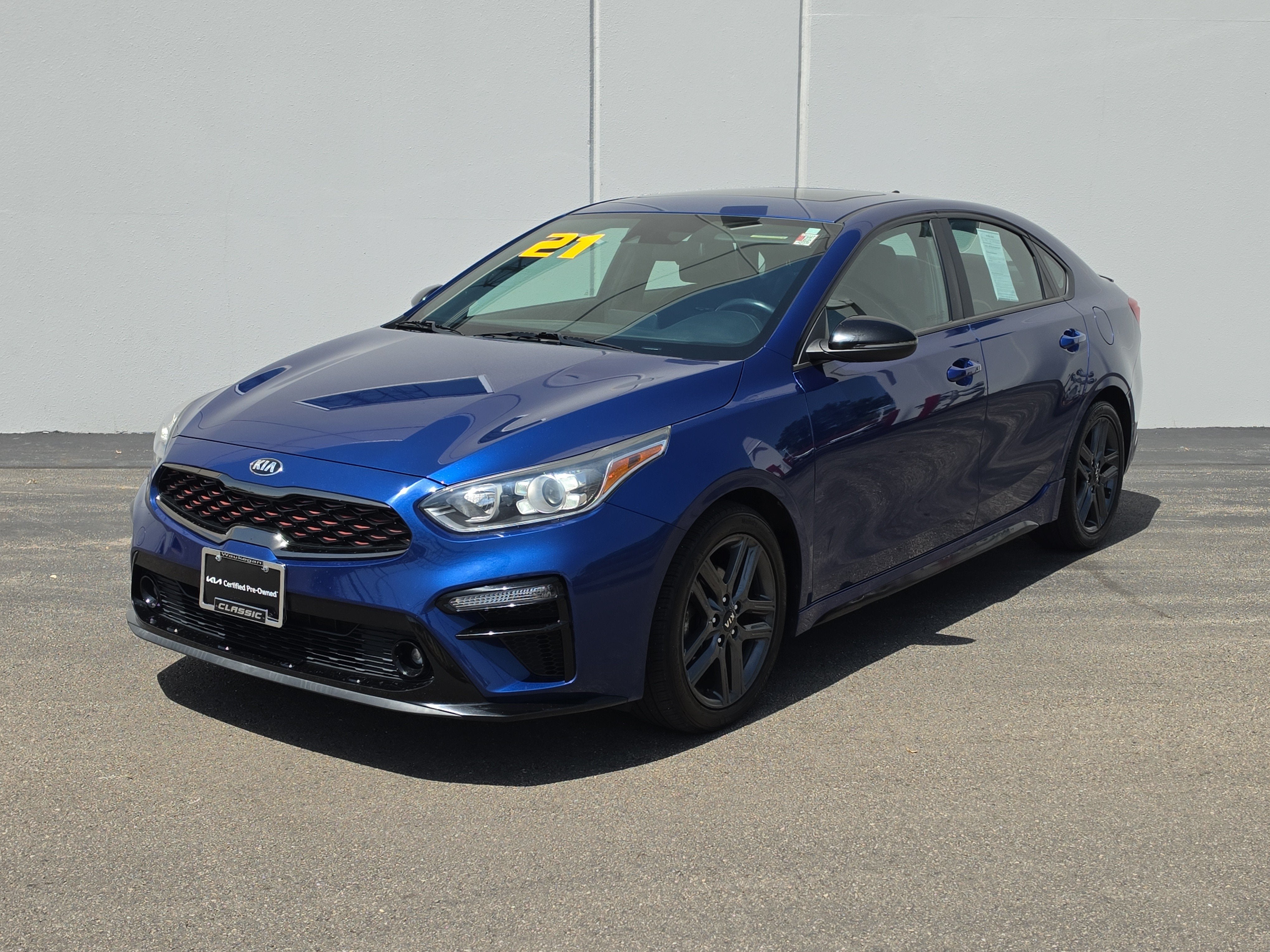 2021 Kia Forte GT-Line in Deep Sea Blue — front three-quarter view