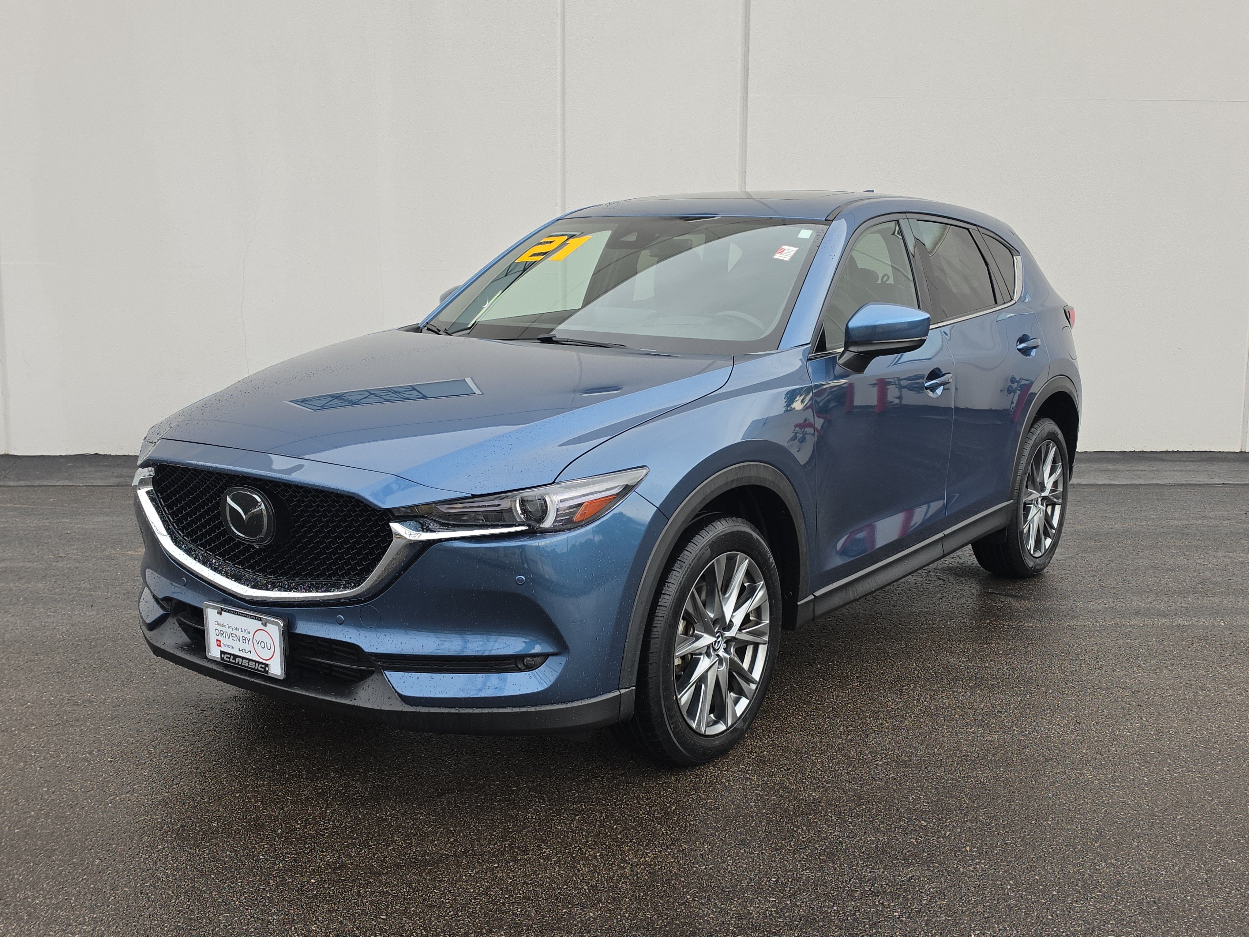 2021 Mazda Mazda CX-5 Signature in Eternal Blue Mica — front three-quarter view