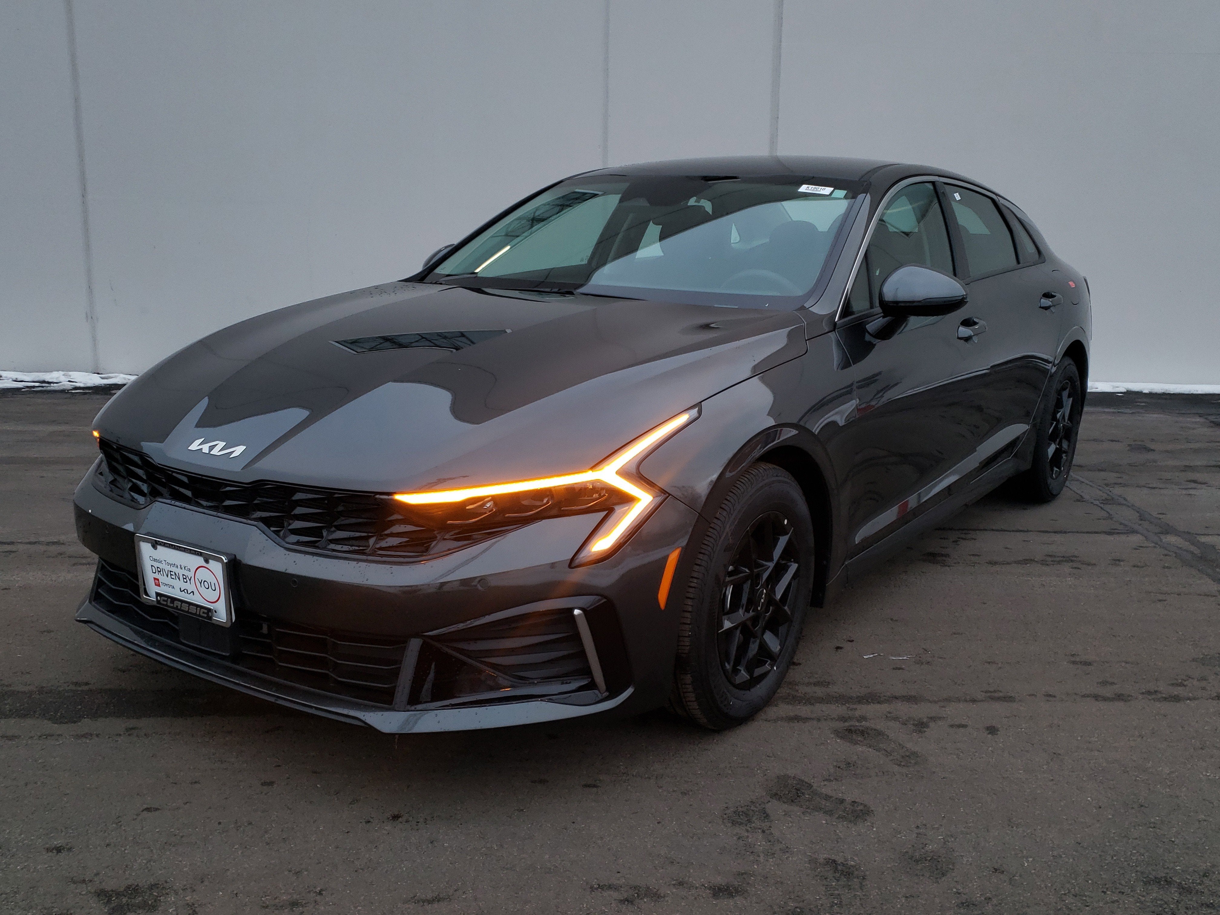 2026 Kia K5 LXS in Interstellar Gray — front three-quarter view