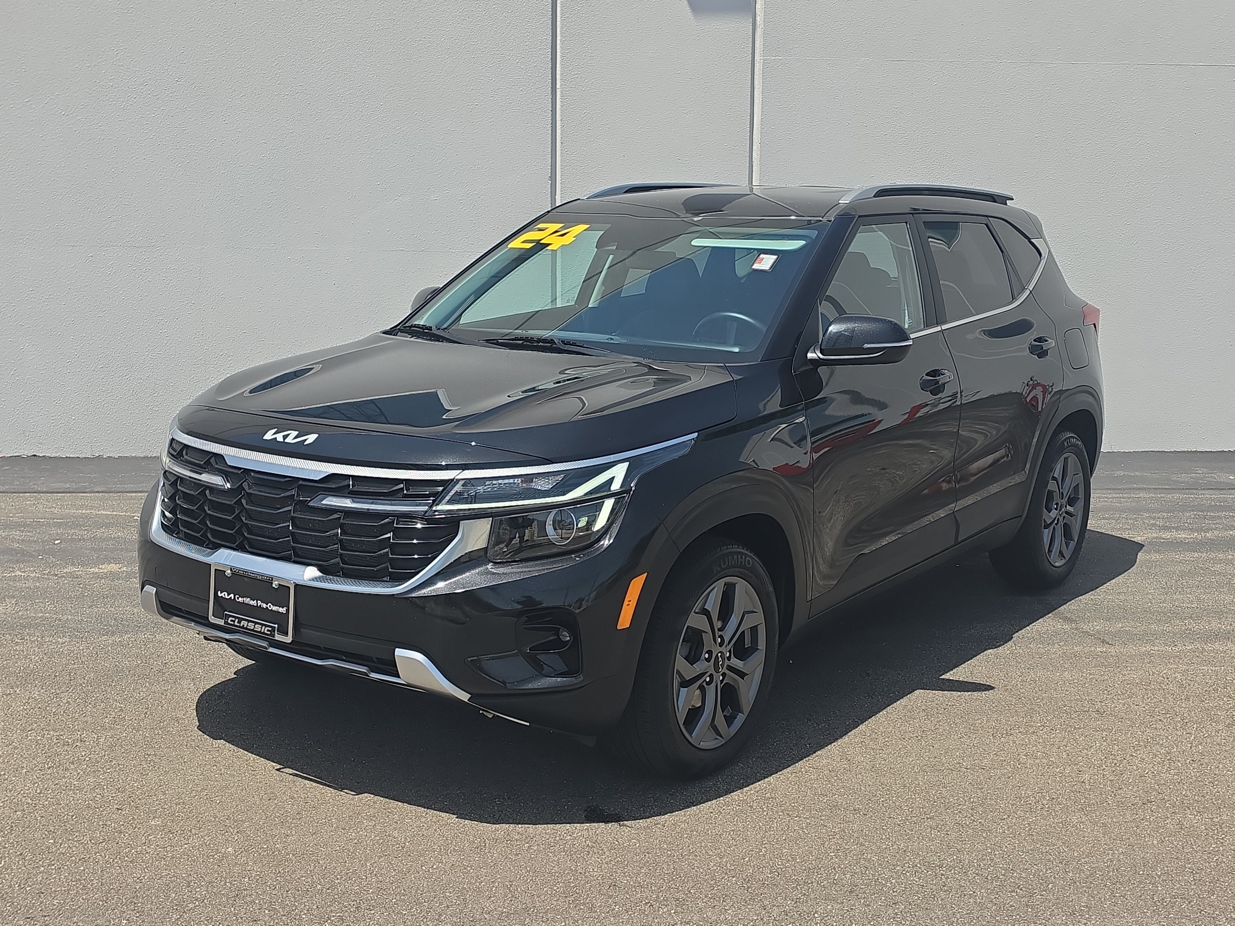 2024 Kia Seltos S in Fusion Black — front three-quarter view